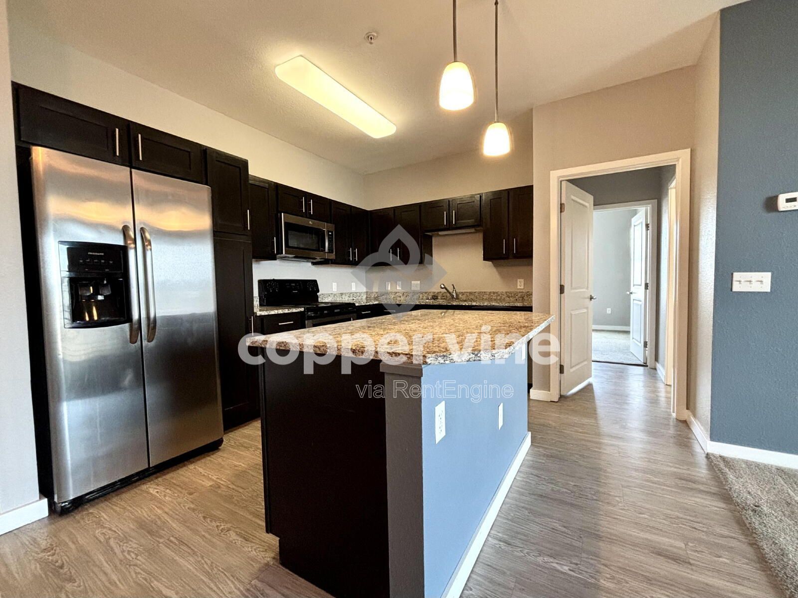 Modern 2BR/2BA Condo with Detached Garage, Community Pool, and Light Rail Access property image