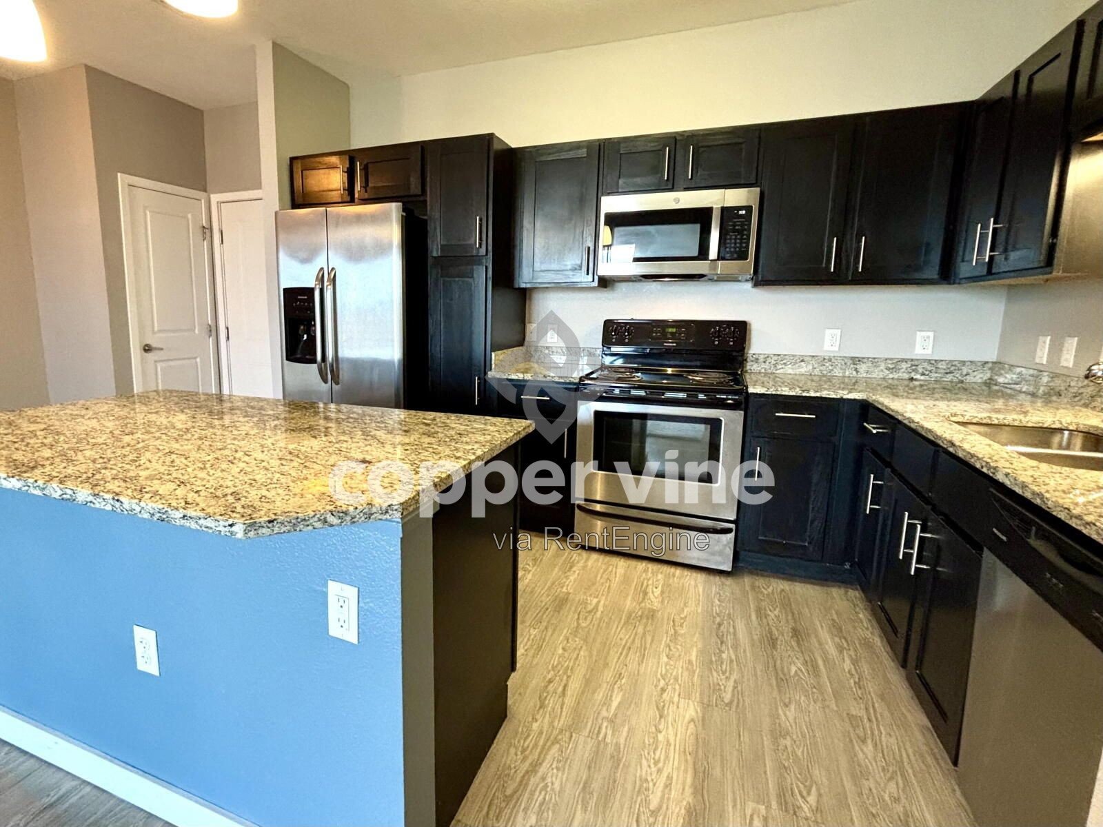 Modern 2BR/2BA Condo with Detached Garage, Community Pool, and Light Rail Access property image